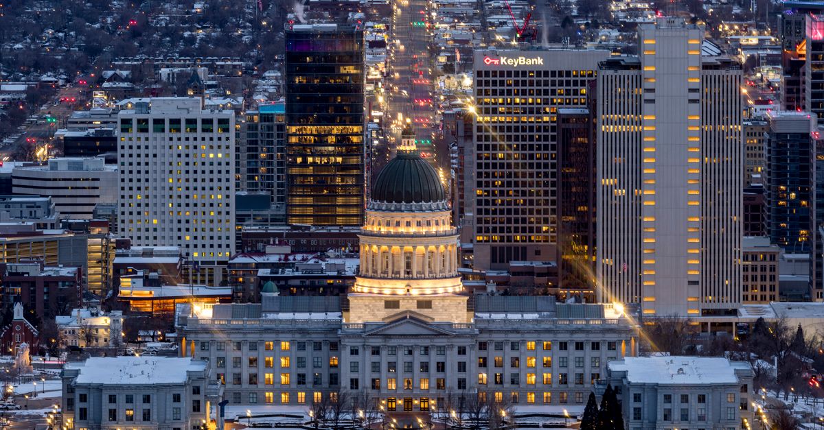A breathtaking view of Salt Lake City's skyline illuminated at night, featuring the Utah State Capitol.